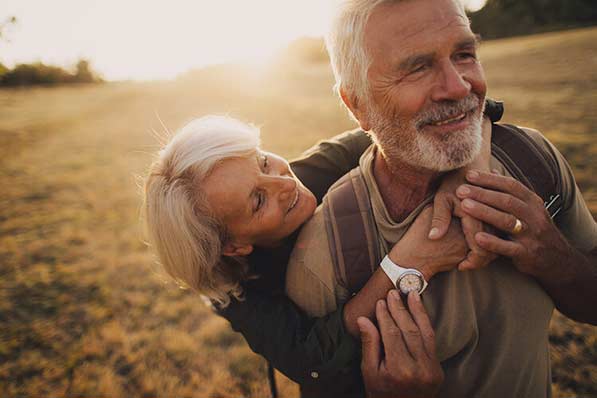 Smiling senior couple embracing intimacy