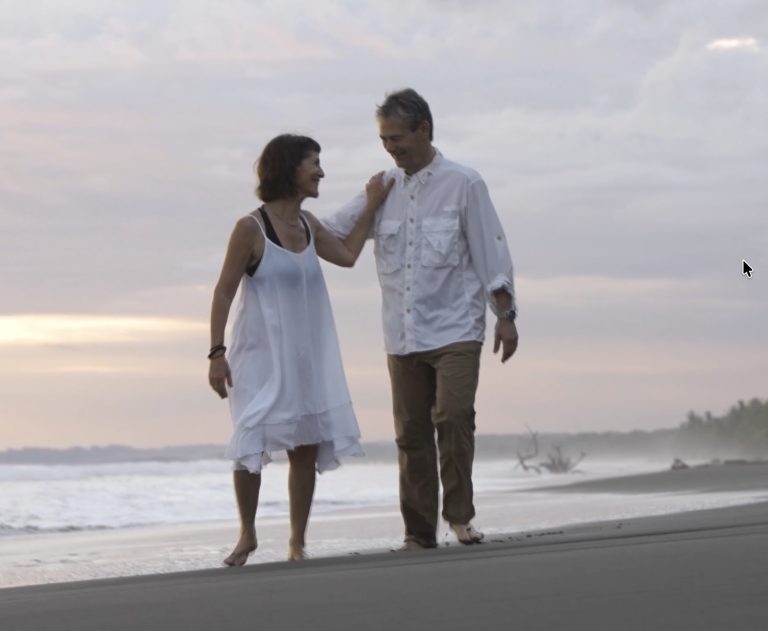 Beach couple playing